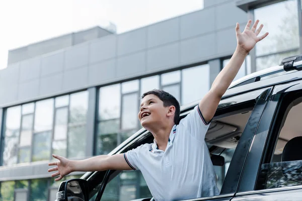 Low Angle View Happy Kid Outstretched Hands Car Window — Stock Photo, Image