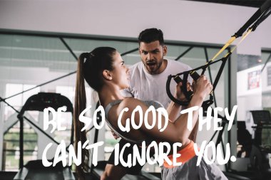 excited trainer shouting while motivating sportswoman pulling up on suspension trainer near illustration with be so good they cant ignore you inscription clipart