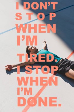 mixed race sportsman laying on running track and spread arms with i dont stop when i am tired, i stop when i am done lettering clipart