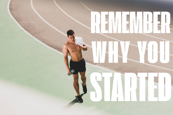 full length view of mixed race sportsman holding towel and sport bottle at stadium with remember why you started lettering