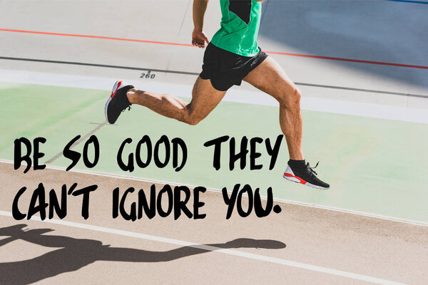 cropped view of sportsman in black sneakers running at stadium with be so good they cant ignore you lettering