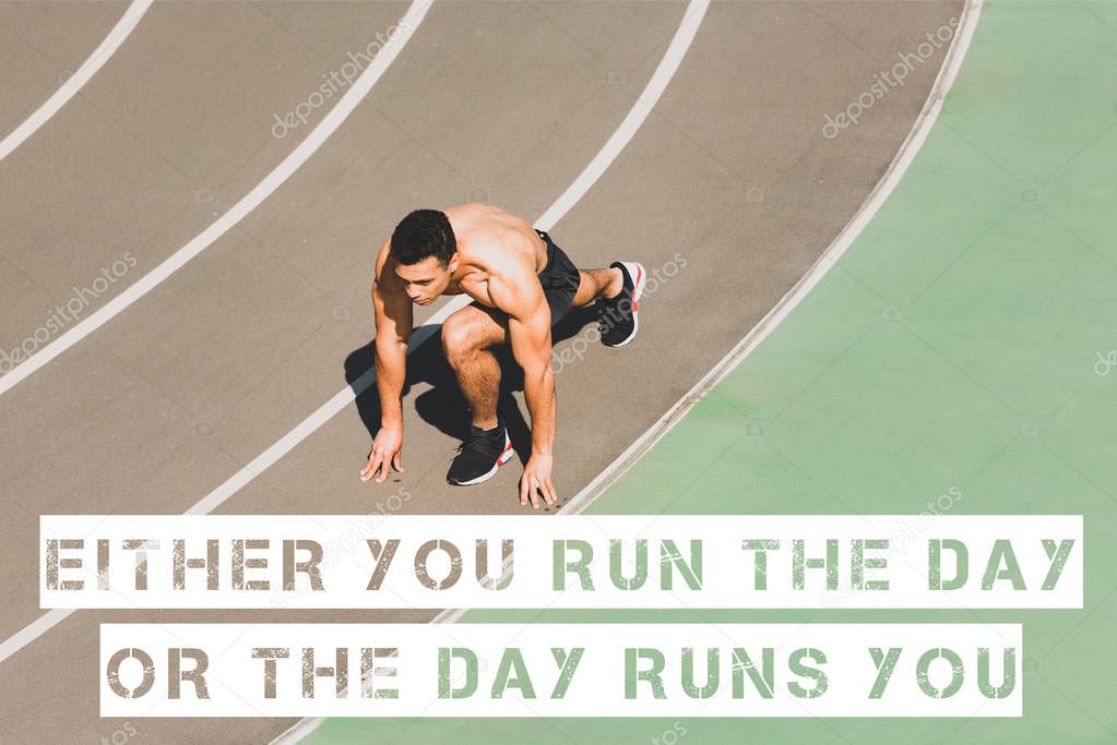 mixed race sportsman preparing to run at stadium with either you run the day or the day runs you lettering