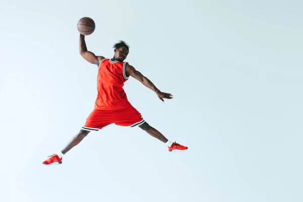 African American Sportsman Jumping While Playing Basketball Isolated Grey — Stock Photo, Image