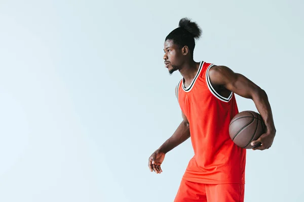 African American Basketball Player Holding Ball Looking Away Isolated Grey — Stock Photo, Image