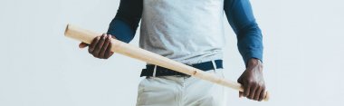 cropped view of african american sportsman holding baseball bat isolated on grey, panoramic shot clipart