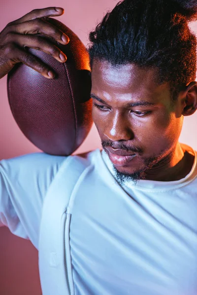 Serious African American Sportsman Holding Rugby Ball Pink Background Gradient — Stock Photo, Image