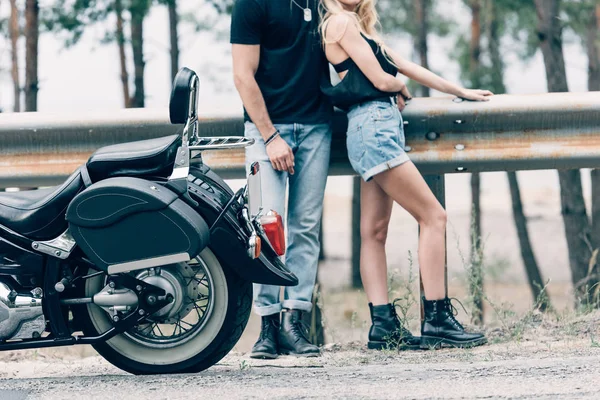 Cropped View Young Couple Bikers Hugging Black Motorcycle Road Green — Stock Photo, Image