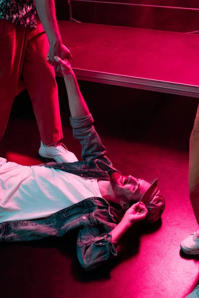 Smiling Man Lying Floor Nightclub Dramatic Lighting — Stock Photo, Image