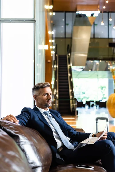 Handsome Businessman Suit Sitting Sofa Holding Newspaper — Stock Photo, Image