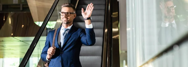 Panoramic Shot Handsome Businessman Suit Glasses Waving Hotel — Stock Photo, Image