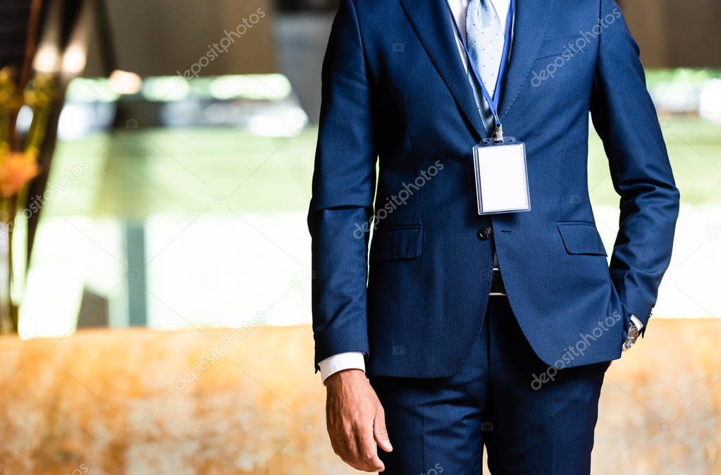 cropped view of businessman in suit with hand in pocket 