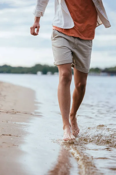 Cropped View Young Man Shorts Running Riverside — Stock Photo, Image