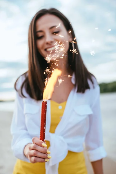 Selective Focus Happy Young Woman Holding Sparkler While Standing Beach — Stock Photo, Image