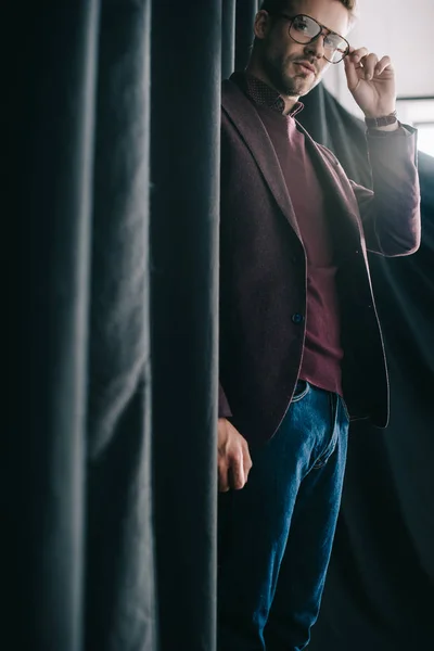 Stylish Young Man Jacket Glasses Standing Curtain — Stock Photo, Image