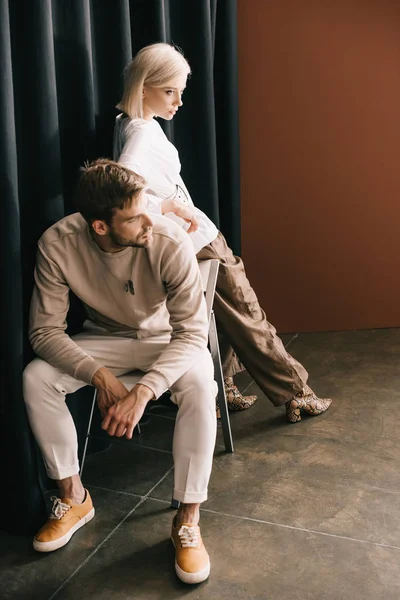 Bearded Man Sitting Chair Attractive Blonde Woman Curtain Brown — Stock Photo, Image