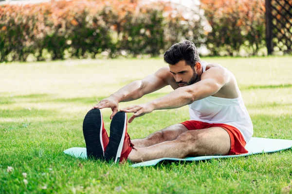 Handsome Sportsman Doing Stretching Exercise Fitness Mat — Stock Photo, Image
