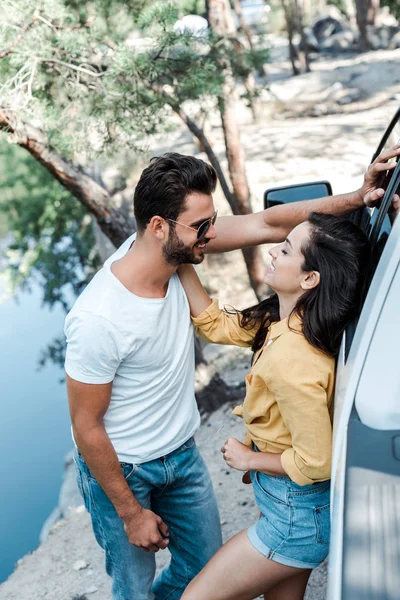 Happy Woman Touching Face Bearded Man While Standing Car — Stock Photo, Image