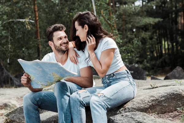 Happy Man Holding Map Cheerful Girl Sitting Stone — Stock Photo, Image