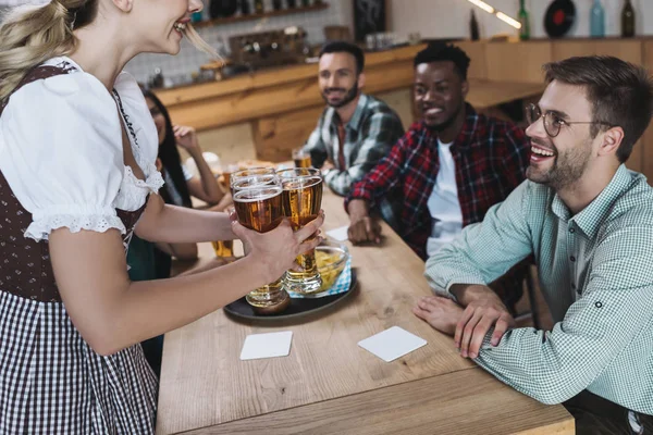 Cropped View Waitress Holding Glasses Light Beer Multicultural Friends — Stock Photo, Image