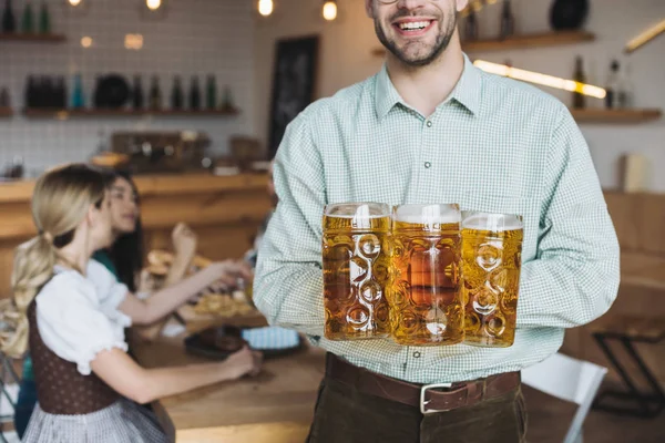 Cropped View Young Man Holding Mugs Beer Smiling Camera — Stock Photo, Image