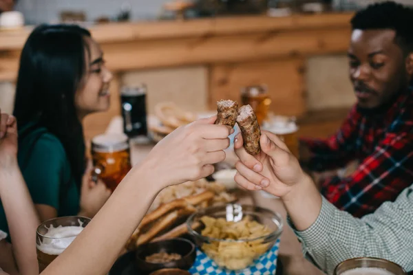 Cropped View Young Woman Woman Holding Fried Sausage While Celebrating — Stock Photo, Image