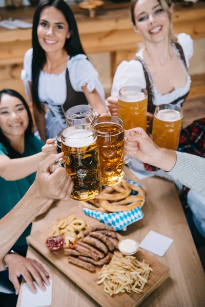 Selective Focus Attractive Waitresses Traditional German Costumes Clinking Mugs Beer — Stock Photo, Image