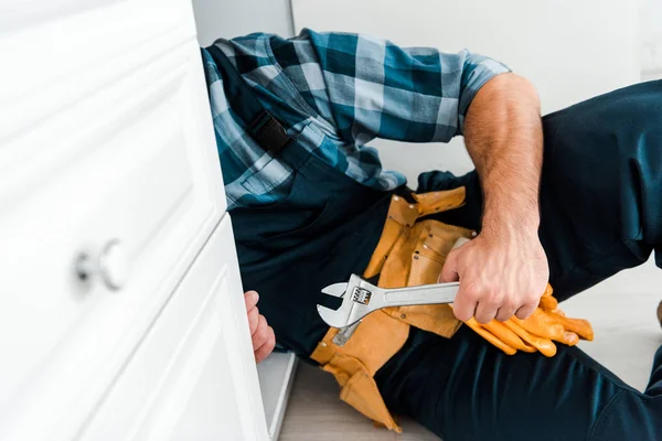 Cropped View Handyman Holding Adjustable Wrench Kitchen Cabinet — Stock Photo, Image