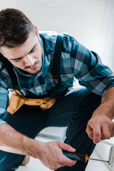Bearded Repairman Uniform Sitting While Fixing Power Socket — Stock Photo, Image