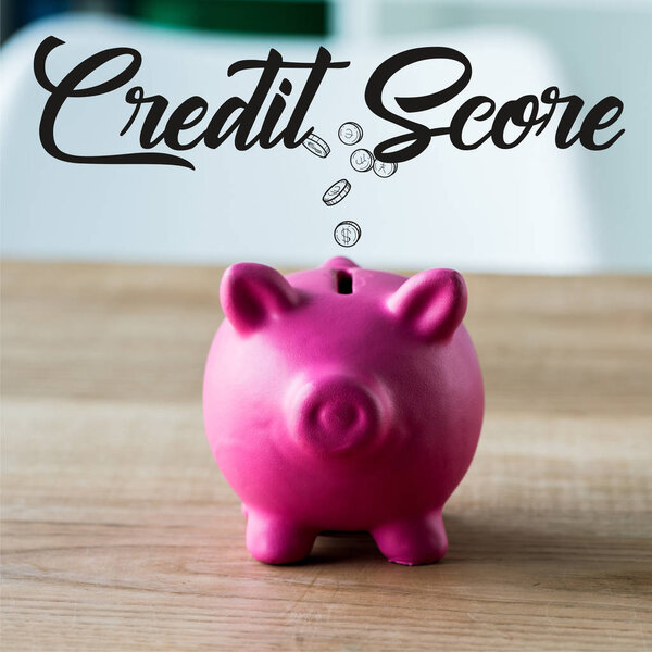 игрушечная копилка на деревянном столе возле кредитного счета надписи в офисе
 