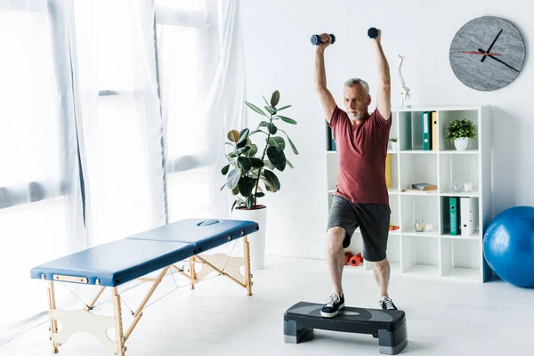 Bearded Mature Man Exercising Dumbbells Clinic — Stock Photo, Image