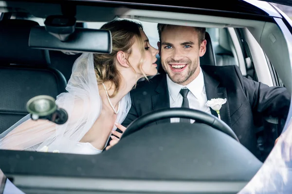 Attractive Bride Bridal Veil Kissing Handsome Bridegroom Car — Stock Photo, Image