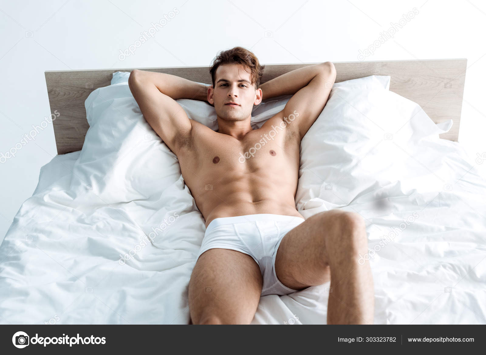 Sexy Young Man Underwear Lying Bed Stock Photo by ©VitalikRadko 303323782