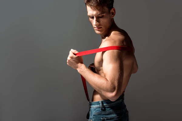 Sexy Man Standing Touching Suspenders Isolated Grey — Stock Photo, Image