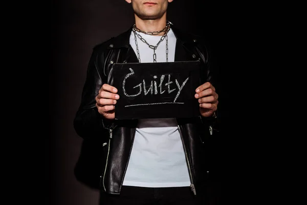 Cropped View Man Holding Chalk Board Guilty Lettering Black — Stock Photo, Image