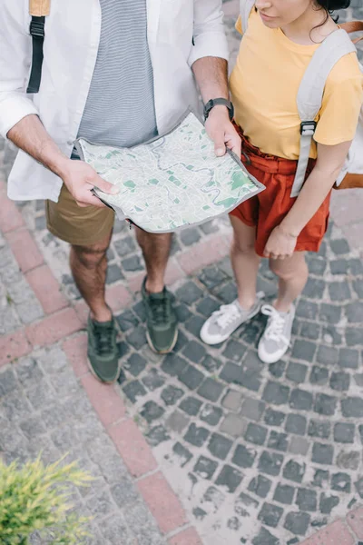 Cropped view of woman standing near man with map — Stock Image Cropped View Woman Standing Man Map Royalty Free Stock Images