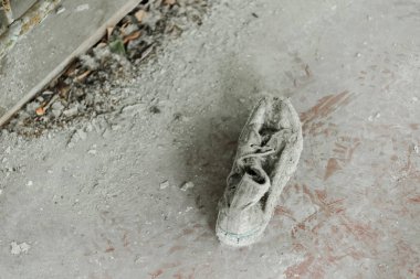 top view of abandoned and dirty shoe on floor  clipart