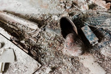 abandoned and dirty shoe on floor in chernobyl  clipart