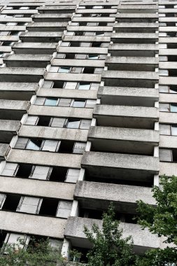 low angle view of building with windows near trees in chernobyl  clipart