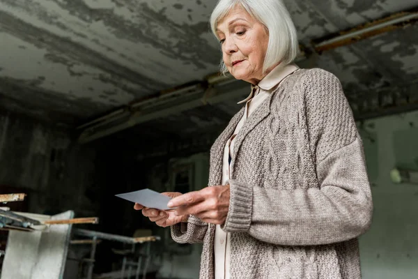 Sad Senior Woman Looking Photo Abandoned School — Stock Photo, Image