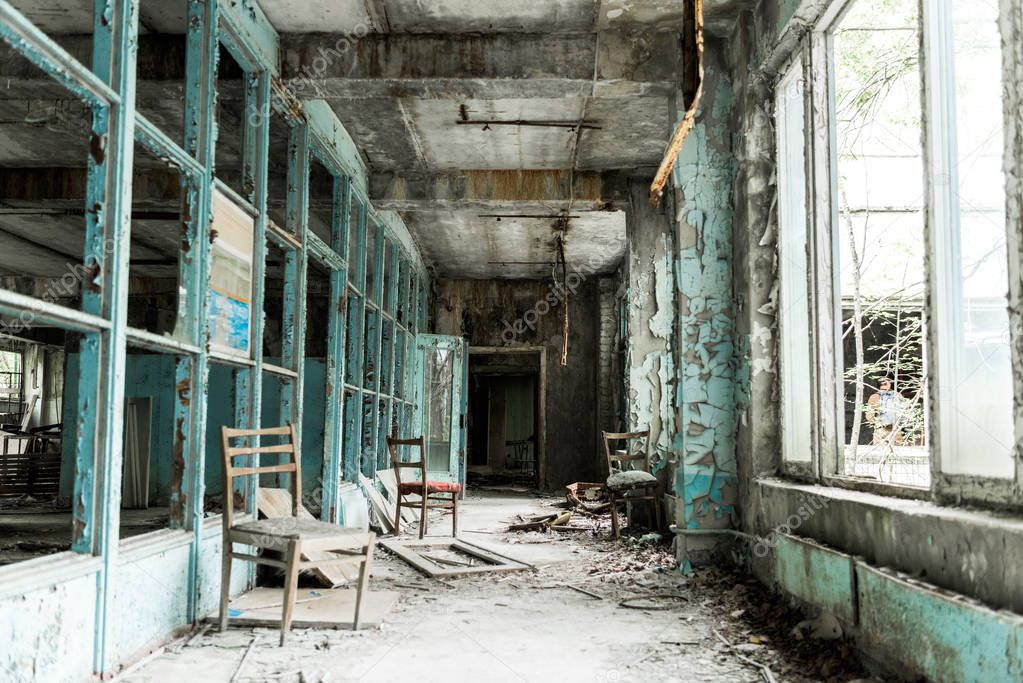 abandoned room with dirty chairs in school 