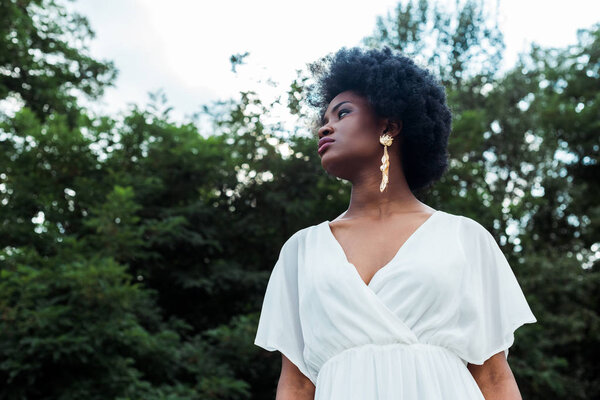 low angle view of beautiful curly african american woman 