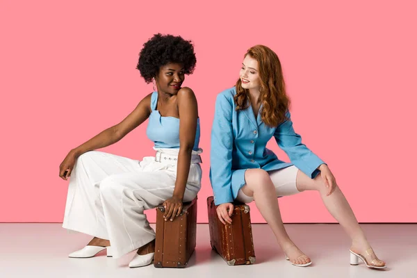 Cheerful Multicultural Women Sitting Suitcases Pink — Stock Photo, Image
