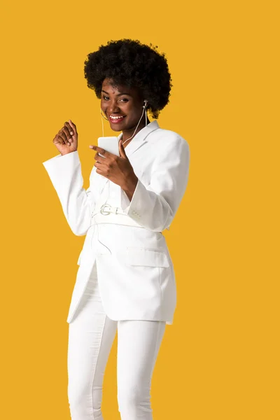 Cheerful African American Girl Listening Music While Holding Smartphone Isolated — Stock Photo, Image