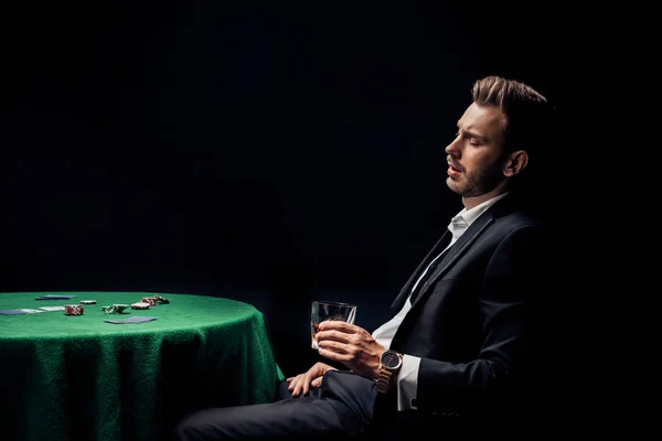 Upset Bearded Man Holding Glass Poker Table Isolated Black — Stock Photo, Image