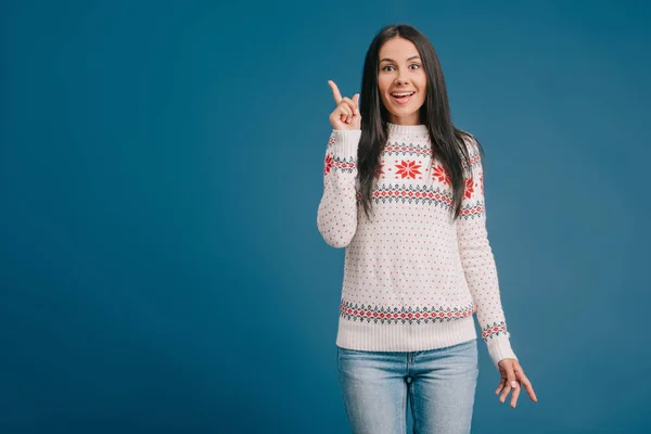 Beautiful Happy Girl Winter Sweater Pointing Something Isolated Blue — Stock Photo, Image