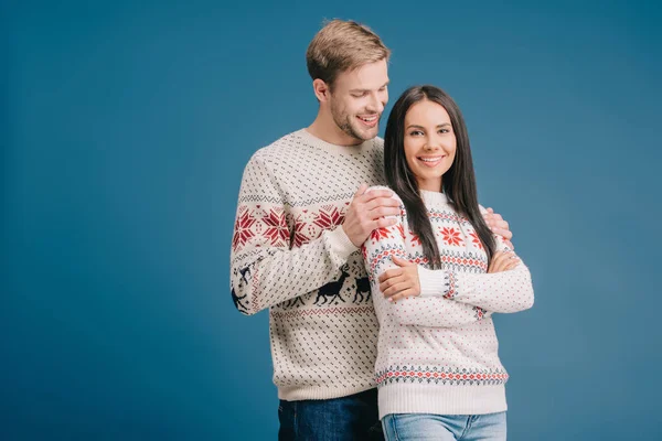 Happy Man Hugging Beautiful Girlfriend Winter Sweater Isolated Blue — Stock Photo, Image