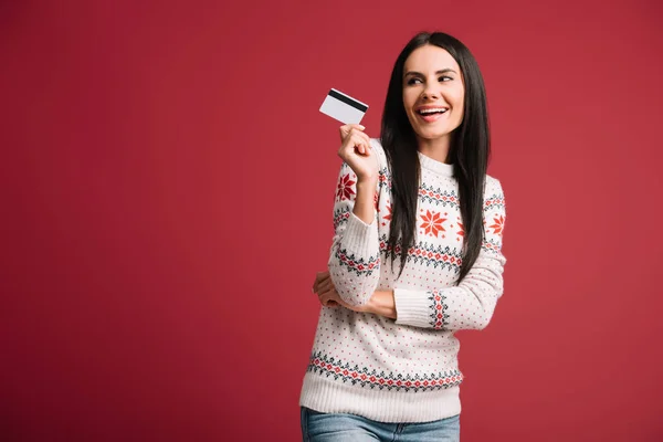 Happy Woman Winter Sweater Holding Credit Card Isolated Red — Stock Photo, Image