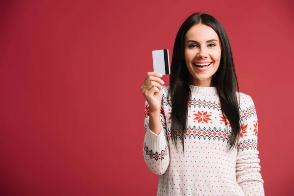 Happy Young Woman Winter Sweater Holding Credit Card Isolated Red — Stock Photo, Image