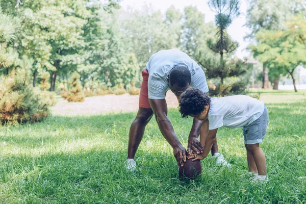 African American Father Teaching Son Playing Rugby Park — Stock Photo, Image