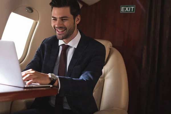 Cheerful Businessman Working Laptop Plane Business Trip — Stock Photo, Image
